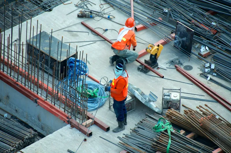 Illustrative construction work showing steel reinforcement and site coordination
